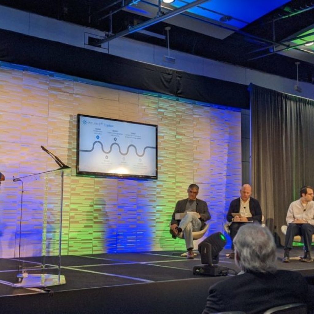 At the Quantum World Congress, Maurice Benson (left), a POLARISqb senior software engineer, presents in front of judges.